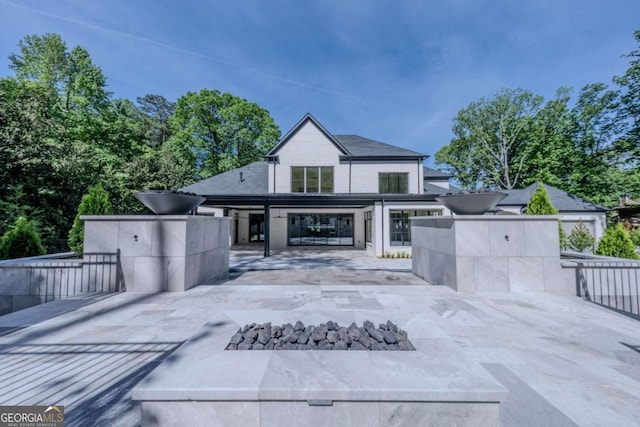 rear view of property with a patio area