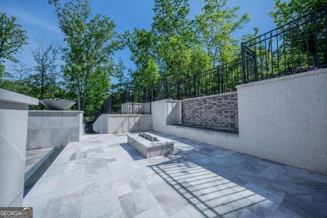 view of patio / terrace featuring a fire pit