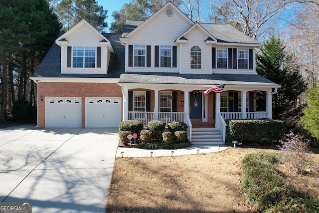 view of front of house featuring a porch and a garage