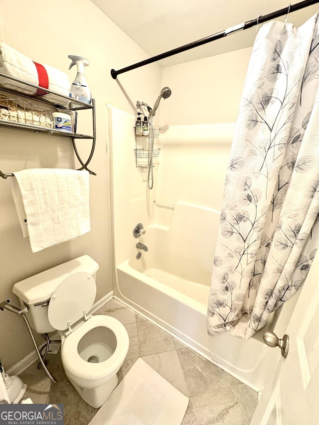 bathroom with tile patterned flooring, shower / bath combination with curtain, and toilet