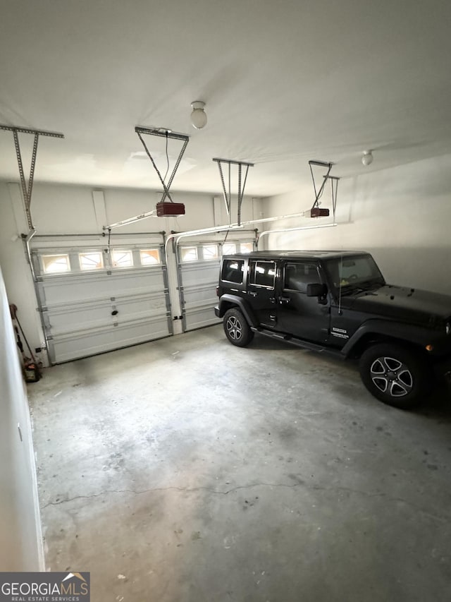 garage featuring a garage door opener