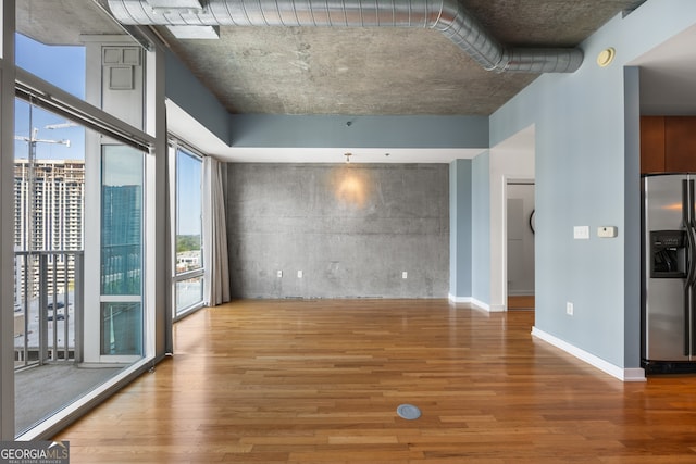 unfurnished living room with hardwood / wood-style flooring