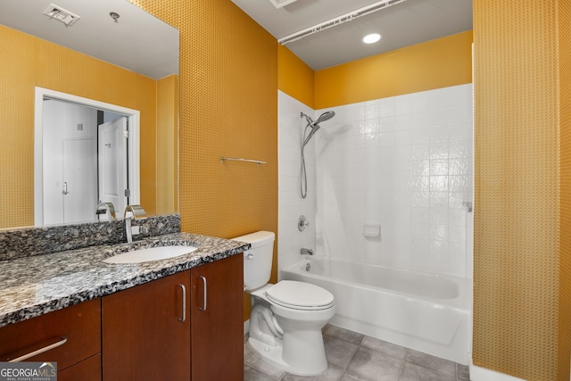 full bathroom with toilet, vanity, and tub / shower combination