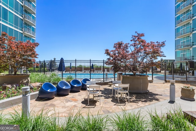 view of patio / terrace featuring a community pool