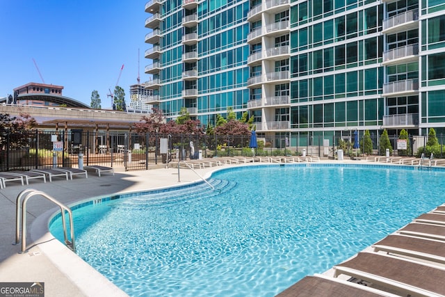 view of pool featuring a patio