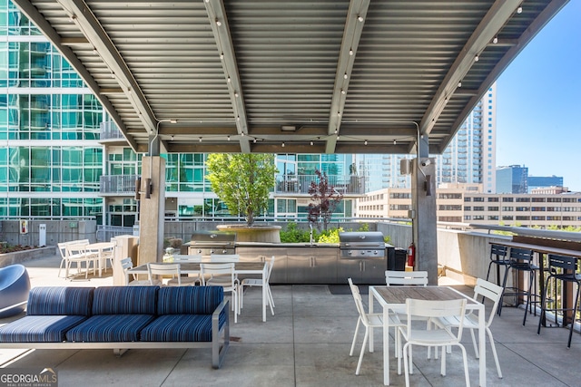 view of patio featuring grilling area, an outdoor living space, and area for grilling