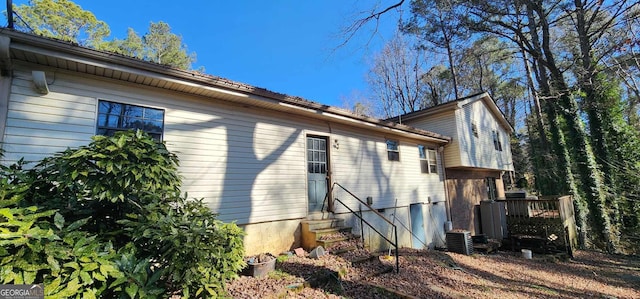 view of side of home featuring cooling unit