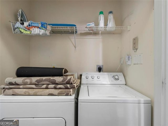 laundry area with separate washer and dryer