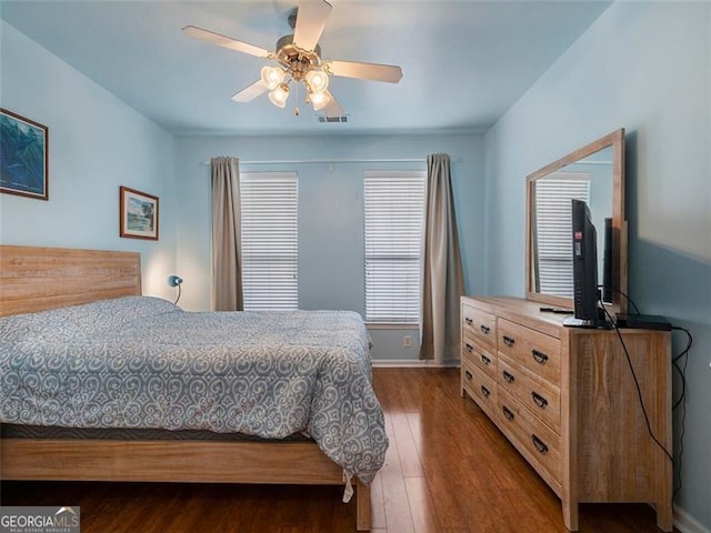 bedroom featuring hardwood / wood-style floors and ceiling fan