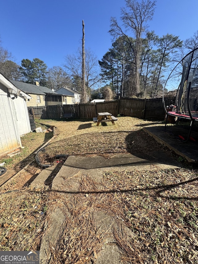 view of yard featuring a trampoline