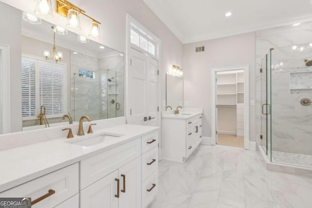 bathroom with vanity, plenty of natural light, an enclosed shower, and crown molding