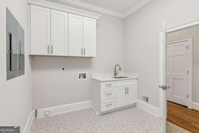 clothes washing area featuring electric dryer hookup, electric panel, crown molding, sink, and hookup for a washing machine