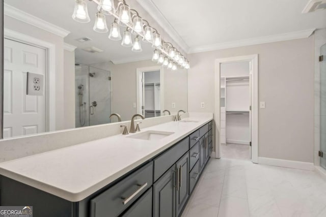 bathroom featuring vanity, a shower with shower door, and ornamental molding