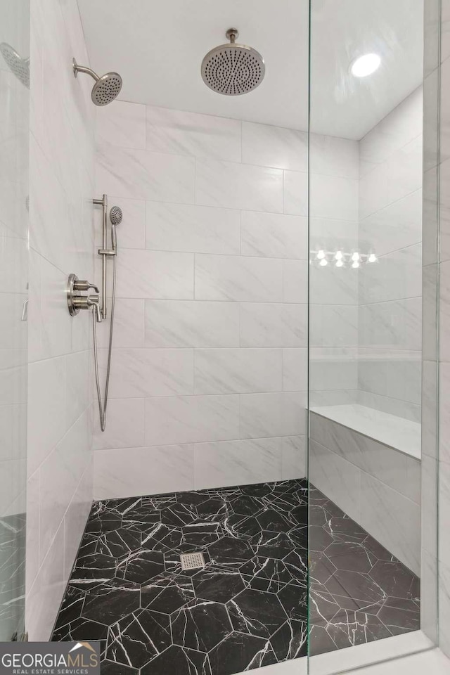 bathroom featuring tiled shower