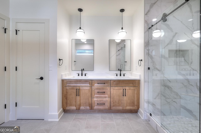 bathroom featuring tile patterned floors, vanity, and walk in shower