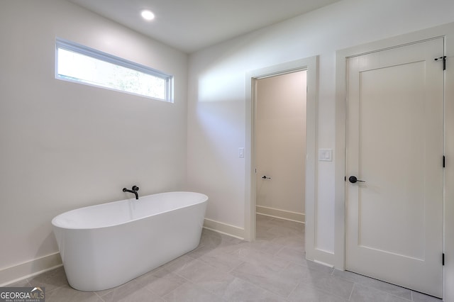 bathroom featuring a tub to relax in