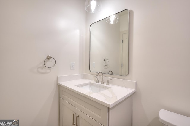 bathroom with vanity and toilet