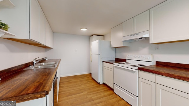 kitchen featuring butcher block counters, white appliances, sink, and white cabinetry