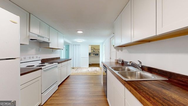 kitchen with wood counters, white appliances, sink, hardwood / wood-style floors, and white cabinetry