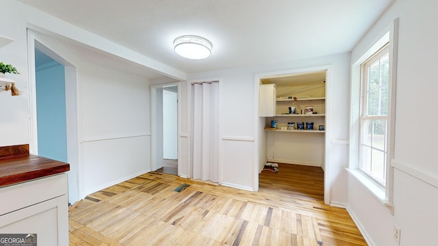 unfurnished dining area featuring light hardwood / wood-style floors