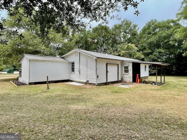 rear view of property with a yard