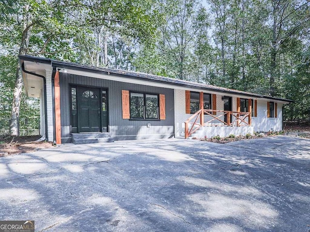 ranch-style home with covered porch