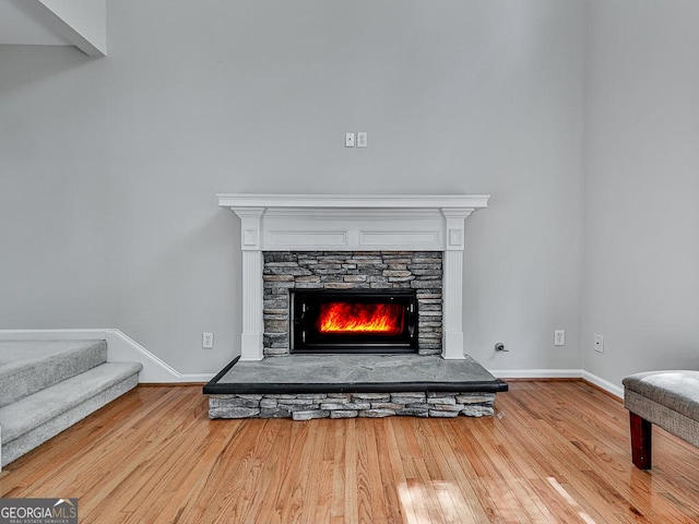 interior details with hardwood / wood-style flooring and a fireplace