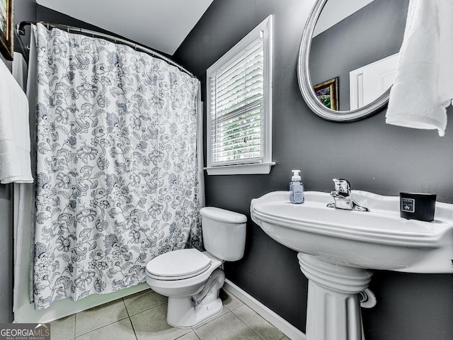 bathroom featuring tile patterned flooring and toilet