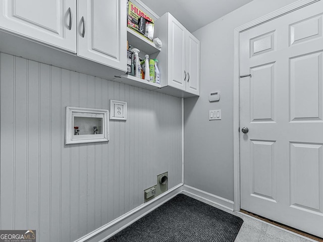 clothes washing area featuring electric dryer hookup, cabinets, and hookup for a washing machine