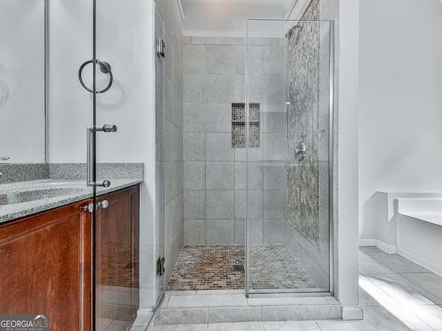 bathroom with tile patterned floors, vanity, and plus walk in shower