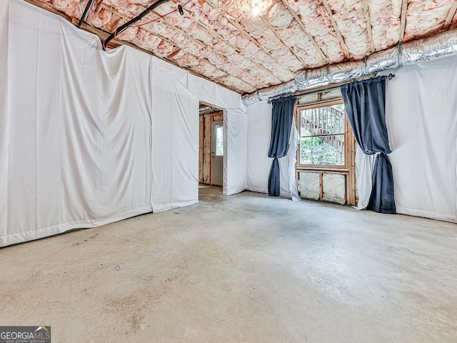 spare room with concrete floors