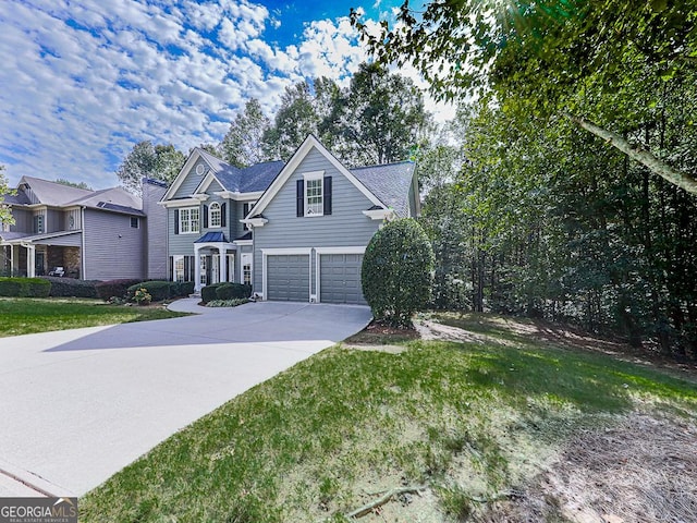 view of front property with a front yard and a garage