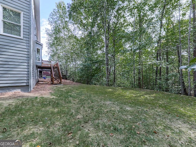 view of yard with a wooden deck