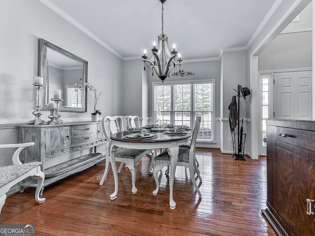 dining area featuring a notable chandelier, dark hardwood / wood-style flooring, and crown molding