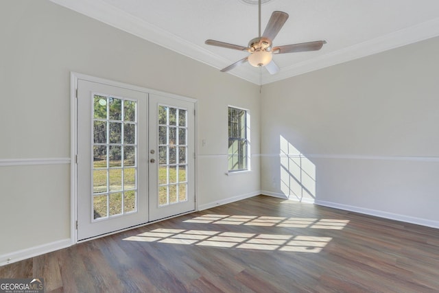 unfurnished room with ceiling fan, dark hardwood / wood-style floors, crown molding, and french doors