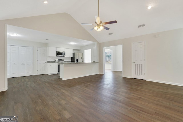 unfurnished living room featuring high vaulted ceiling, ceiling fan, and dark wood-type flooring