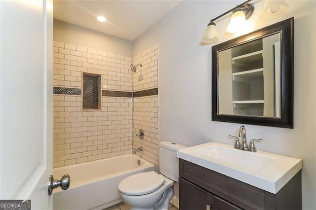 full bathroom with toilet, tiled shower / bath combo, and vanity