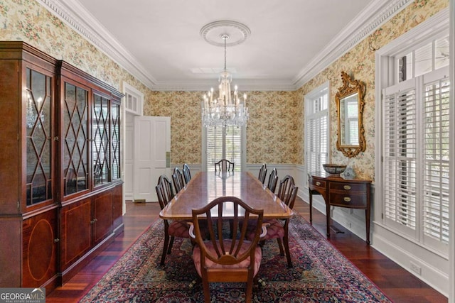 dining space featuring a chandelier, dark hardwood / wood-style floors, and ornamental molding