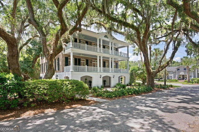 view of front of property with a balcony