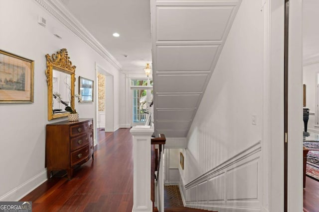 stairway with crown molding and hardwood / wood-style floors