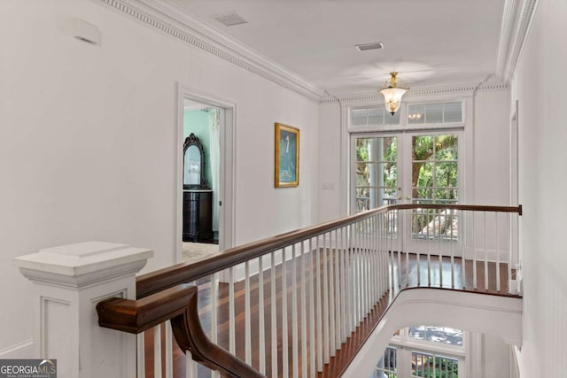 hall featuring crown molding and french doors