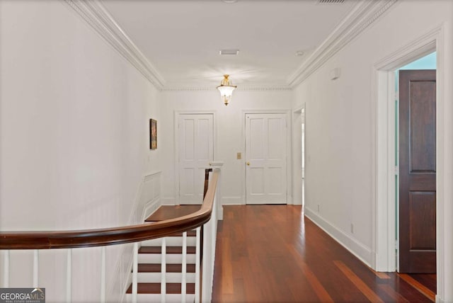 corridor featuring crown molding and dark wood-type flooring