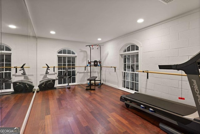 workout room with dark hardwood / wood-style floors