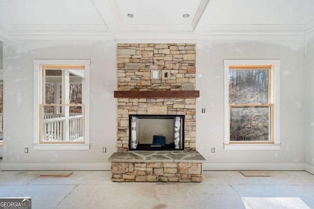 unfurnished living room with a stone fireplace and crown molding