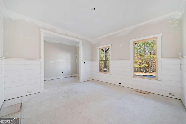 unfurnished room featuring ornamental molding