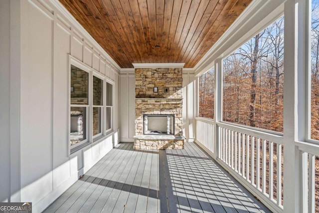 unfurnished sunroom with wooden ceiling