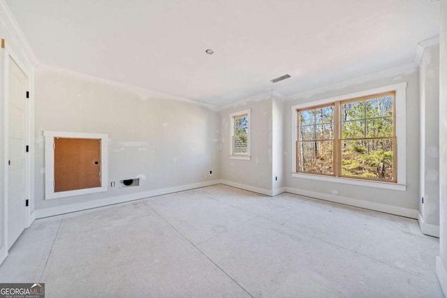 spare room with plenty of natural light and ornamental molding