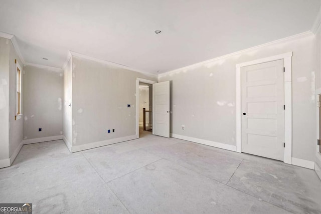 unfurnished room featuring ornamental molding