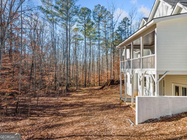 view of yard featuring a sunroom