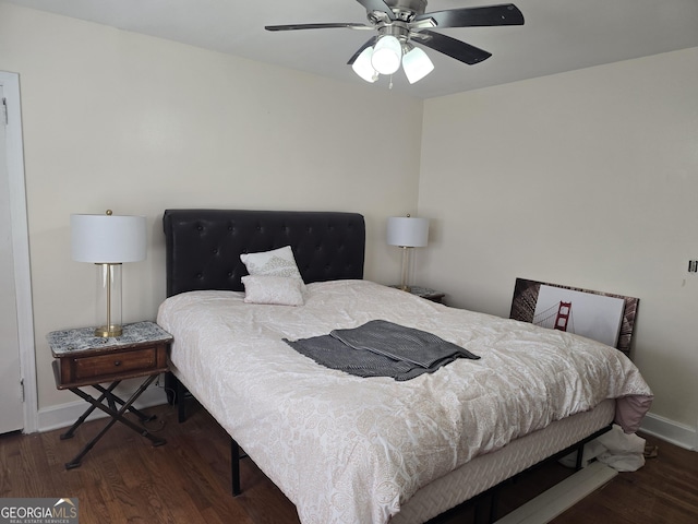 bedroom with ceiling fan and dark wood-type flooring